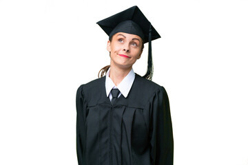 Young university graduate  caucasian woman over isolated background and looking up