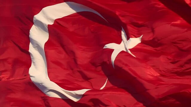 Turkish Flag or Turk Bayragi waving in the wind in full frame view. FullHD Flag of Turkey video. 23 nisan or 19 mayis or 29 ekim or 30 agustos concept video.