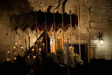 Virgin Mary of Faith and Charity on her throne with lighted candles during the procession during...