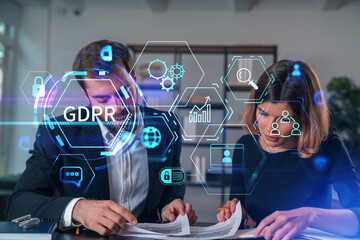 Businesspeople in formal wear taking notes signing contract at office workplace. Concept of important working moments, document sign, working process, concentration. GDPR hologram