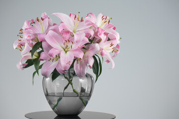 Beautiful lily flowers bouquet in a glass vase. Lillies. Pink lilies design. Big bunch of fresh fragrant lilies purple background. 