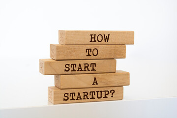 Wooden blocks with words 'How to Start a Startup?'.