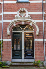 Fototapeta na wymiar Typical dutch architectural detail, a door in Amsterdam