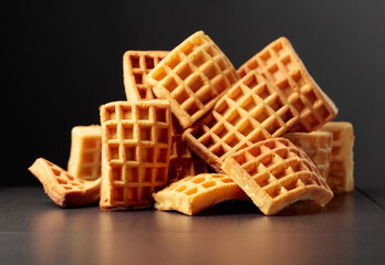 Belgian waffles on a black background.