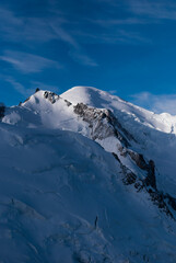 Sunlight on snowy mountain in Alps