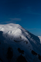 Fototapeta na wymiar View on snowy mountain top in Alps