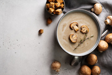 Mushroom soup close up with ingredient on white table