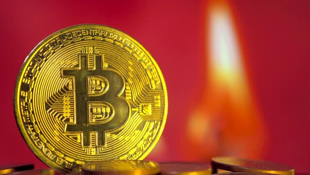 bitcoin on a blurred burning dollar sign background