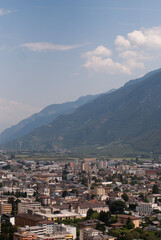 Fototapeta na wymiar Village in mountains in Alps in sunny day