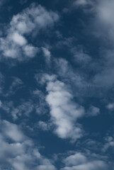 View on white clouds in the blue sky