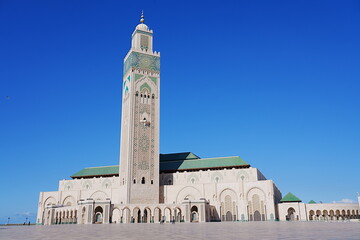 View to Hassan II mosque with minaret at Casablanca city in Morocco - obrazy, fototapety, plakaty