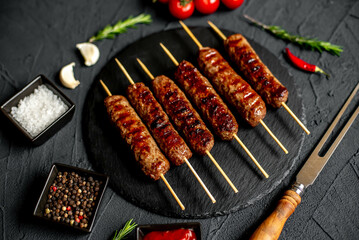Grilled homemade lula kebab on a stone background