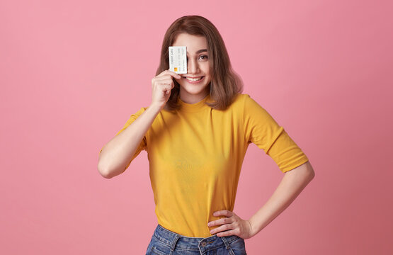 Happy Woman Showing Presenting Credit Card For Making Payment Or Paying Online Business, Trust And Confidence For Making Payment.