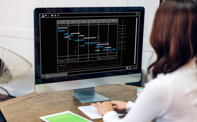 Asian businesswoman with calendar schedule time plan appointment management taking note and...