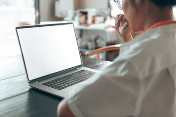 woman using laptop computer. Blank screen laptop mock up.