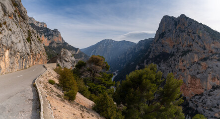 narrow mountain road leads into the wild and rugged landscape of the Verdon Gorge in southeastern...