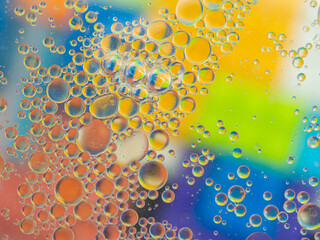 A colorful background with bubbles and water droplets. mulicolor backdrop and blurred with oil...