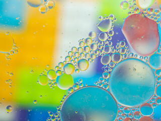 A colorful background with bubbles and water droplets. mulicolor backdrop and blurred with oil dropes.