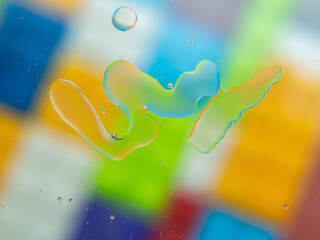 A colorful background with bubbles and water droplets. mulicolor backdrop and blurred with oil dropes.