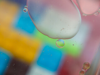 A colorful background with bubbles and water droplets. mulicolor backdrop and blurred with oil...