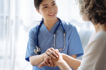 Female doctors shake hands with patients encouraging each other  To offer love, concern, and encouragement while checking the patient's health. concept of medicine.