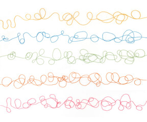 Obraz premium Tangled colorful cotton threads isolated on white background. Abstract thread lines pattern.