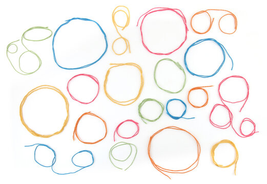 Frames or speech bubbles of colorful cotton threads isolated on white background. Set of different  circular thread shapes.