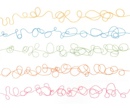 Tangled colorful cotton threads isolated on white background. Abstract thread lines pattern.