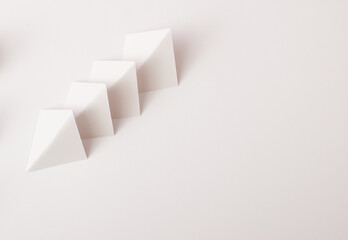 White geometric 3d shapes on white background with copy space