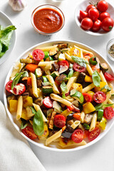 Penne pasta salad with baked vegetables