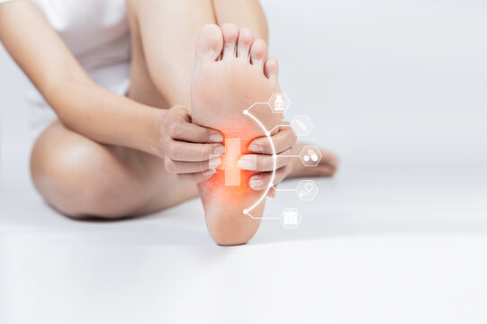 Foot pain, plantar fasciitis pain in the foot of the elderly. Symptoms of peripheral neuropathy. Most symptoms are numbness in the fingertips and foot.Healthcare problems and podiatry medical concept.