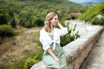 Close-up portrait of a beautiful young woman resting against the backdrop of nature, copy space