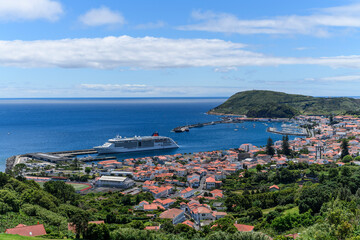 Fototapeta na wymiar View over Horta, there is a cruise ship in the harbour / View over the city of Horta, a cruise ship is in the port, Azores, Portugal.