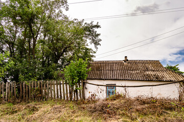 Fototapeta na wymiar Beautiful old abandoned building farm house in countryside on natural background