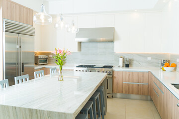 Luxury white kitchen with granite or quartz countertops - obrazy, fototapety, plakaty
