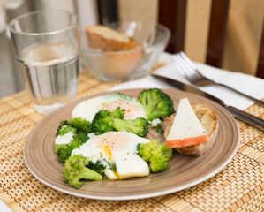 breakfast of crumpled eggs with broccoli