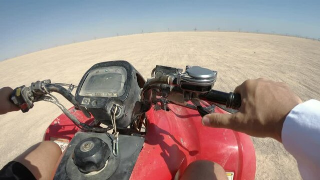 Safari tour with group of people on quad bikes - active leisure in Egypt resorts, driver POV