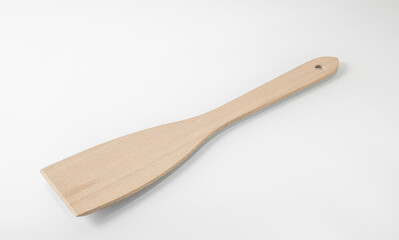 Wooden kitchen utensils. Large wooden spatula for turning steaks