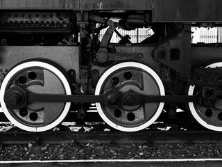 huge wheels of an old train - black and white photo