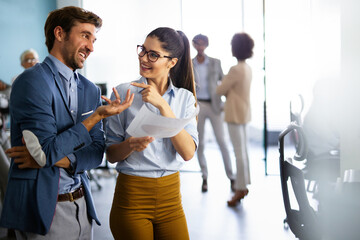 Portrait of successful business people working together in corporate office.