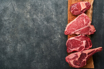 Raw prime steaks. Variety of fresh black angus prime meat steaks T-bone, New York, Ribeye,...