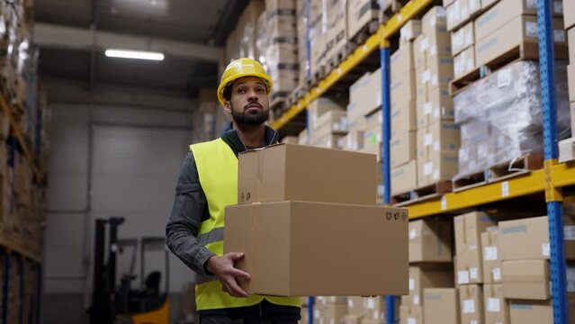 Warehouse worker stocking goods in a warehouse.