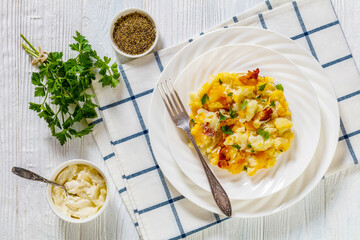 cauliflower bacon cheese casserole on white plate