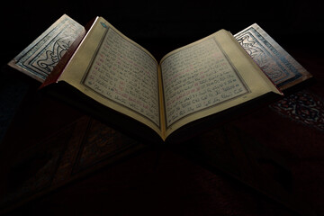 Islamic background photo. The Holy Quran or Kuran-i Kerim in focus