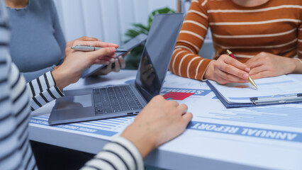 small business accounting team meeting three asian people with salary monthly charts data, basic...