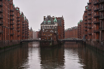 Hamburg Speicherstadt. The Warehouse District (Speicherstadt) in Hamburg, Germany, at dusk. Old town on the water canals. HafenCity in Hamburg, Germany.