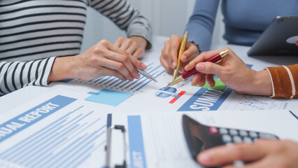 small business accounting team meeting three asian people with salary monthly charts data, basic business accounting and bookkeeping concept.