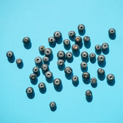 Top view of fresh blueberry on blue background