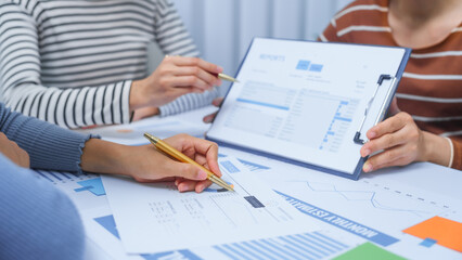 small business accounting team meeting three asian people with salary monthly charts data, basic business accounting and bookkeeping concept.