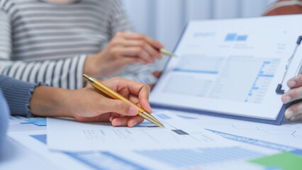 small business accounting team meeting three asian people with salary monthly charts data, basic business accounting and bookkeeping concept.